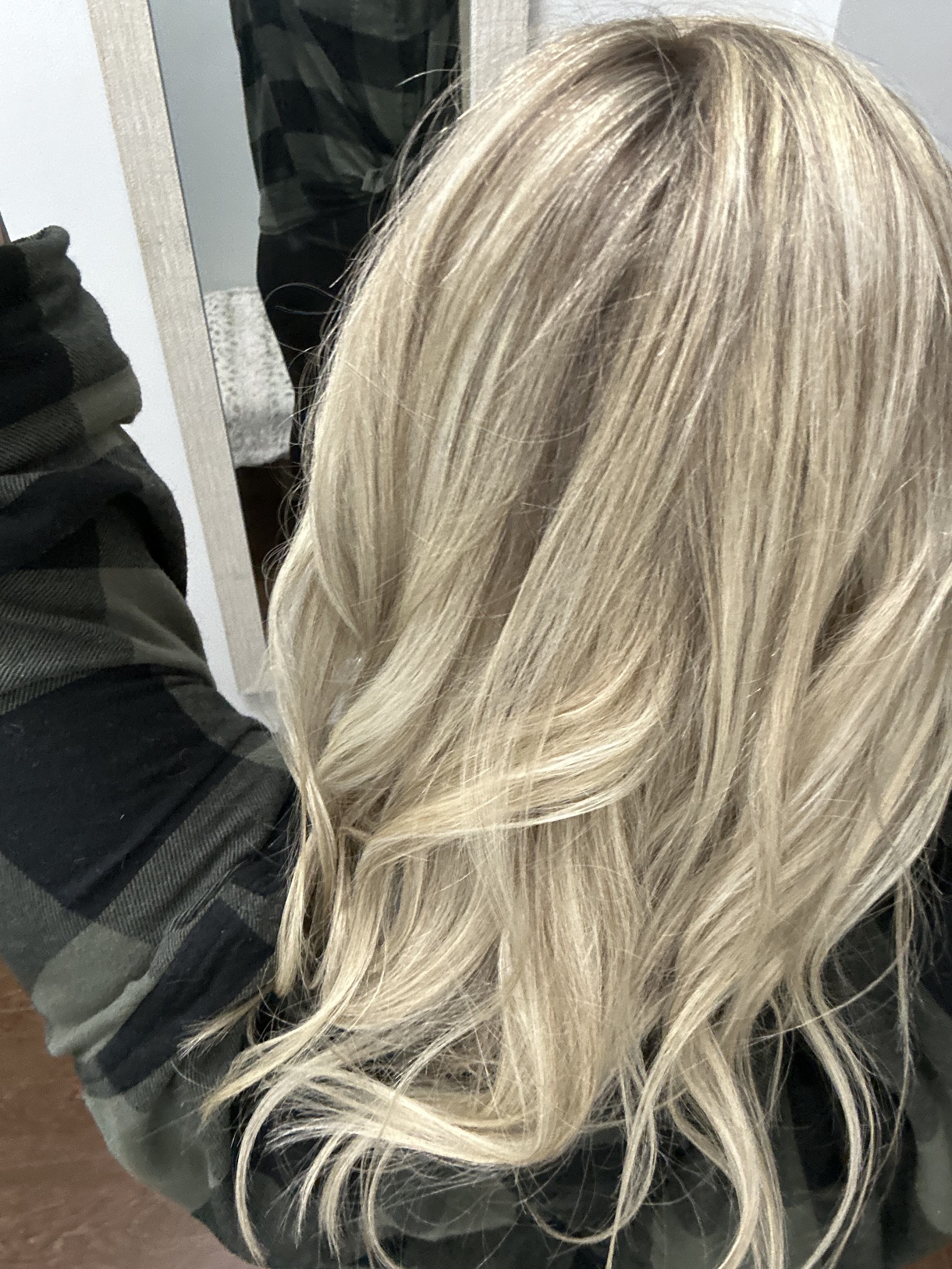 Long blonde balayage and soft waves result from Maryjo's Hair Design